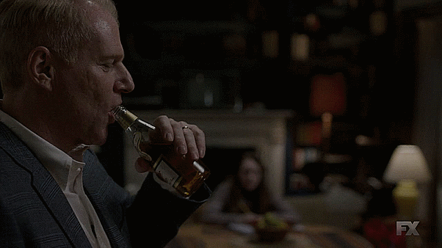 Stan drinking beer, looking at Paige